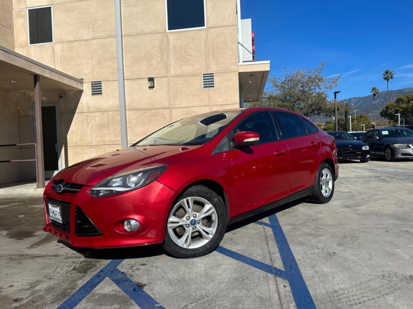 2012 RED /BLACK Ford Focus SE Sedan (1FAHP3F29CL) with an 2.0L L4 DOHC 16V engine, AUTOMATIC transmission, located at 30 S. Berkeley Avenue, Pasadena, CA, 91107, (626) 248-7567, 34.145447, -118.109398 - New Tires! Nice Interior! drives and looks good! Bad credit? We can help! We are the bank. All our cars are thoroughly inspected and reconditioned by our technicians. FREE CARFAX report. Stop by or call to speak with our friendly staff. Whether you have bad credit, no credit, bankruptcy, or reposse - Photo#0